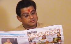 Amit Kumar reading newspaper