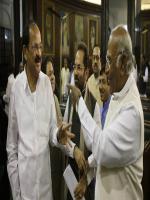 Indian Congress party member of Parliament Mallikarjun Kharge, right, 