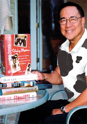 Gus Lee with his Books