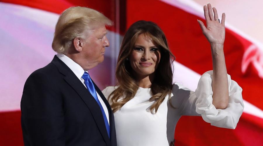 Melania Trump stands with her husband Republican U.S. presidential candidate Donald Trump