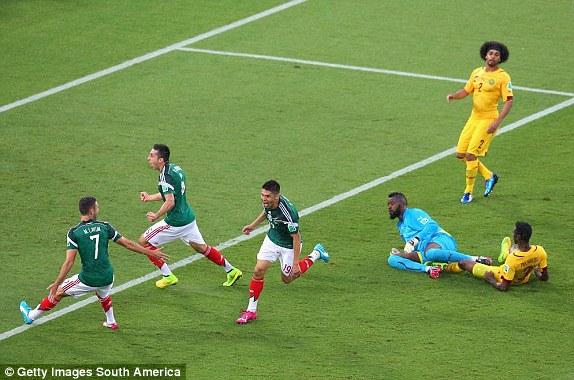 Oribe Peralta of Mexico (center) celebrates his goal with teammates Miguel Layun (left) and Hector Herrera (2nd left)