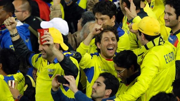 Ecuador fans celebrate their team winning the game