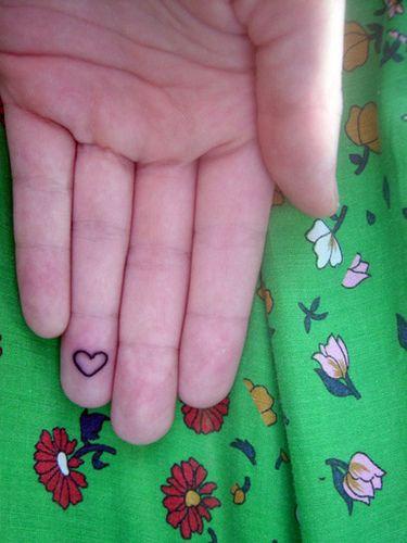 Heart tattoo at finger