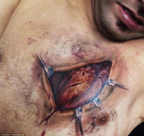 This hyper-realistic tattoo is quite gross to look at, but the skill a