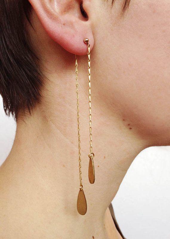 Brass drop earrings add subtle sparkle.