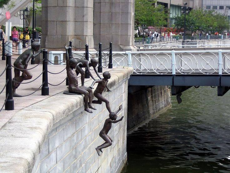 while jumping into river statue