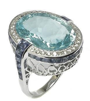 Oval aquamarine, sapphire, diamond, and white gold ring.