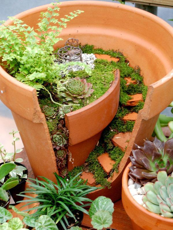 Use every bit of your broken pot, add moss, tiny plants and rocks to f