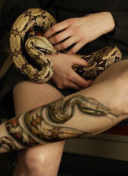Realistic snake tattoo.