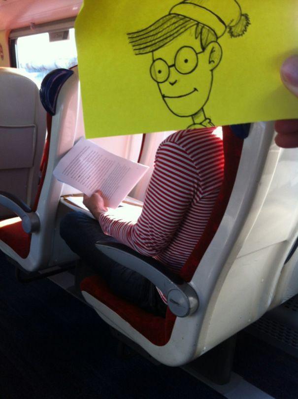 cartoon faces on sticky notes that he matches up with the bodies of un