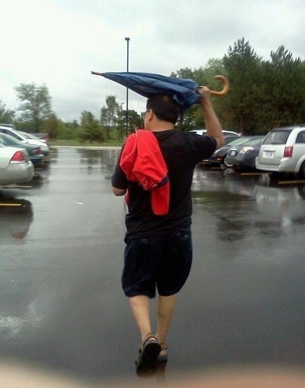 Anyone that uses an umbrella like this.. 35 Ridiculously Dumb People T