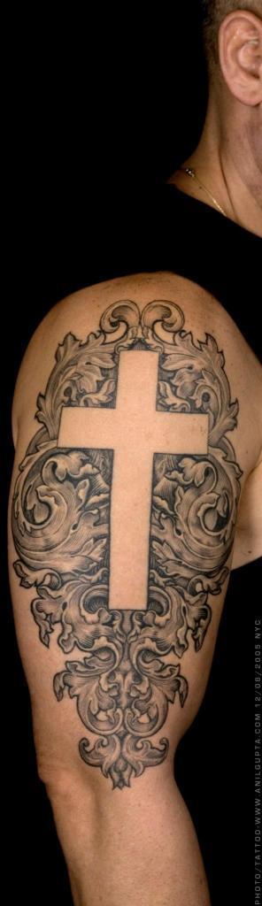 simple white cross tattoo on shoulder for men - Tattoo for men