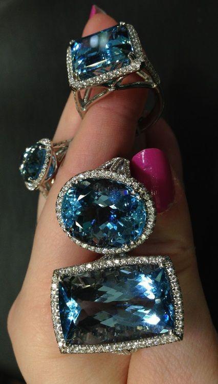 Aquamarine and diamond rings by Coast Diamond. Via Diamonds in the Library